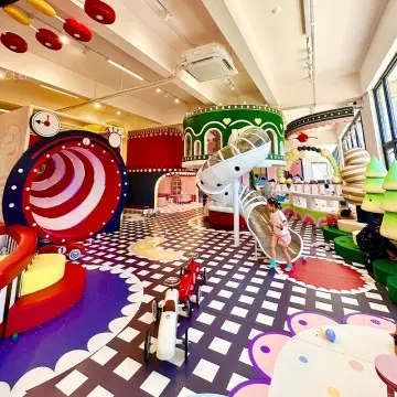 Top indoor playground factory designs minimalist Morandi play equipment with haze slides, large trampoline zones and professional ninja courses.
