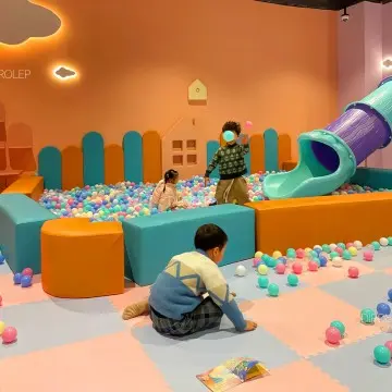 Themed diversified indoor playground factory manufacturing immersive interactive equipment including slides, trampolines, climbing walls and handmade craft stations